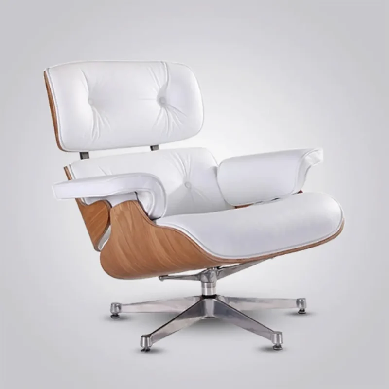 The back and profile of an ash wood eames chair lounge chair with a white leather interior and chrome hardware.