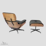 Front view of a premium Charles Ray Eames replica lounge chair highlighting the tufted black leather.