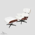 Angled view of the complete white leather eames lounge chair and ottoman set.