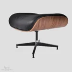 Matching ottoman for an Eames lounge chair knock off featuring black leather and a walnut shell.