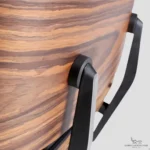 Close-up of the wood veneer and hardware on a high-end Eames chair replica.