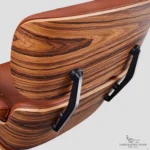 Close-up of back hardware and 7-ply rosewood veneer on a lounge chair charles eames.