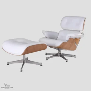 A white leather Eames style lounge chair and matching ottoman set viewed from the side.