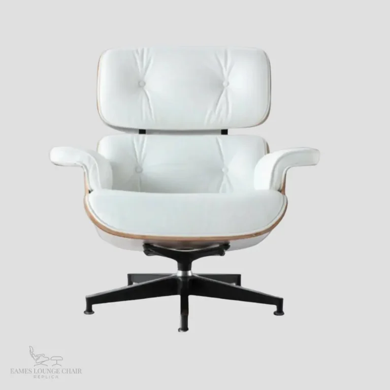 Side view profile of an ergonomic white leather eames armchair replica with walnut wood accents.