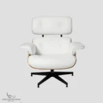 Front view of a white leather eames lounge chair and ottoman with rosewood shell.