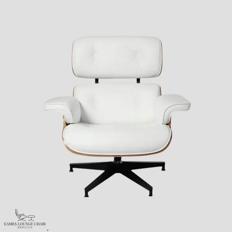 Front view of a white leather eames lounge chair and ottoman with rosewood shell.