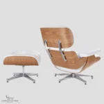 Rear view of an Eames style lounge chair featuring ash wood grain panels and white leather upholstery.